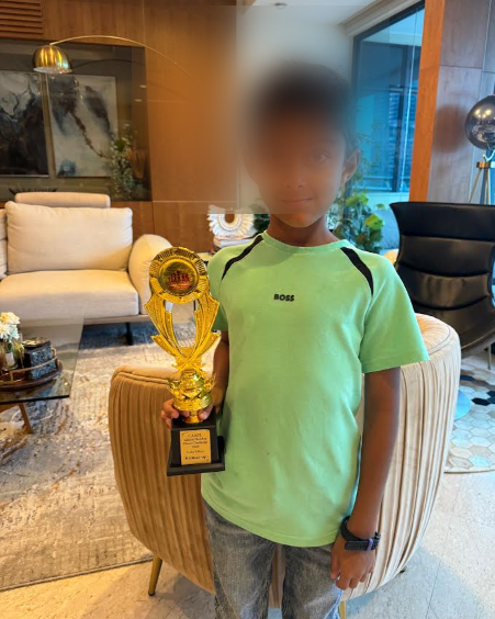Jai holding his Runner-Up Trophy from the Chess Academy Singapore tournament, June 2024